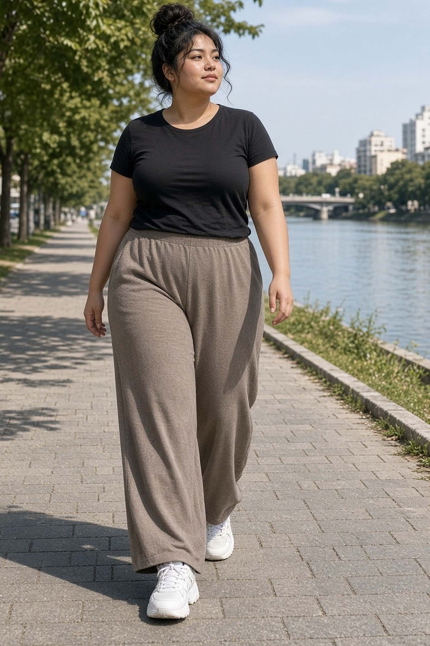 Plus-size woman in wide-leg taupe joggers and black tee